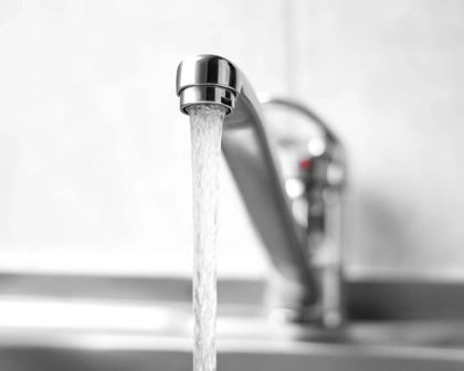 Water Runs From A Metal Water Tap